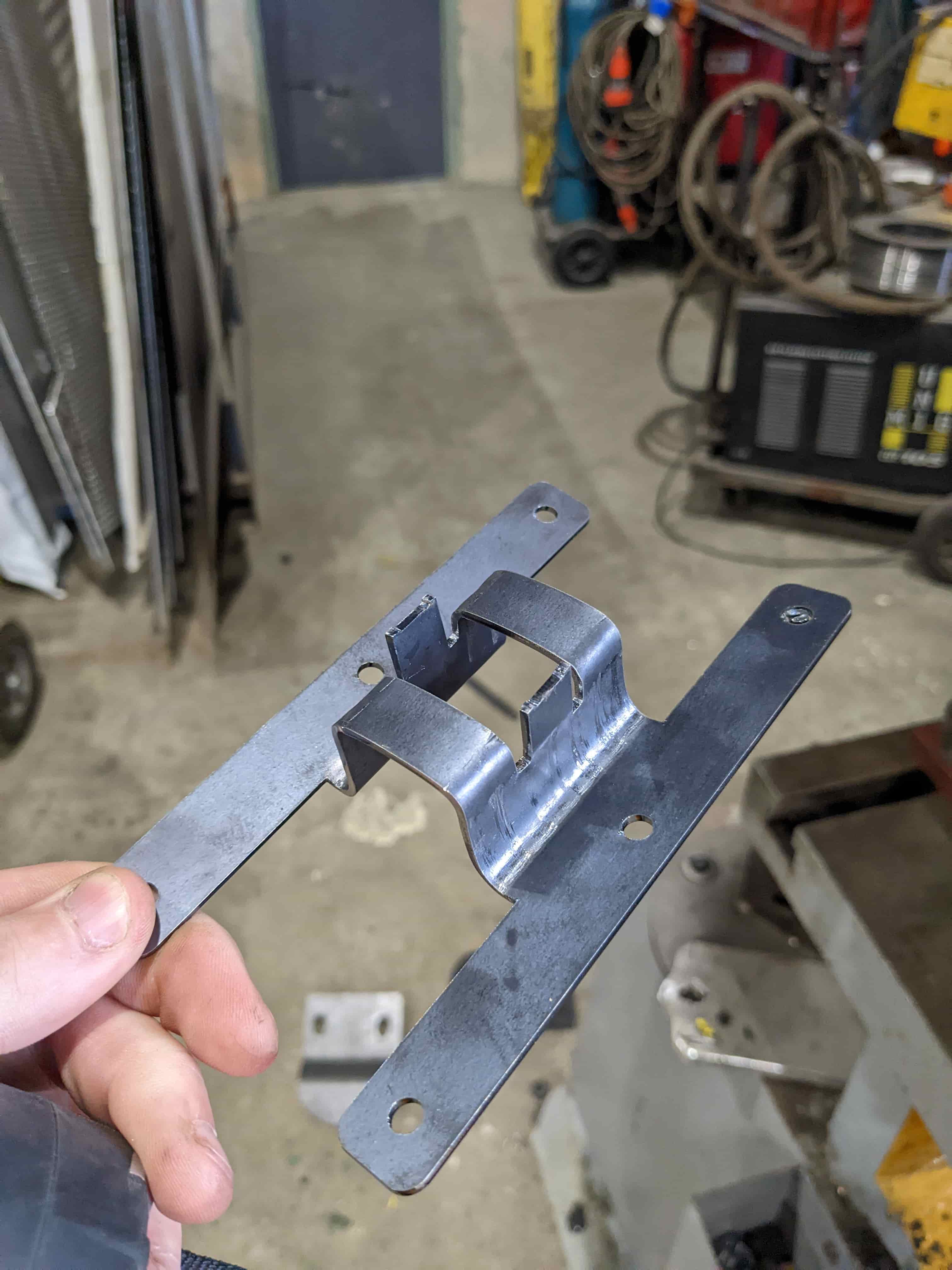 Fabricated steel clamping bracket produced from the CAD design