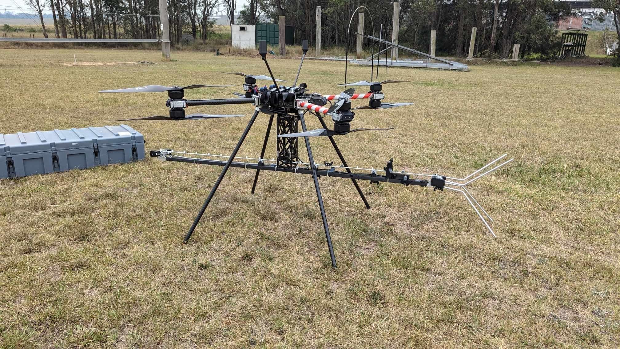 Large multirotor drone fitted with the complete Rotamarka installation payload during field testing