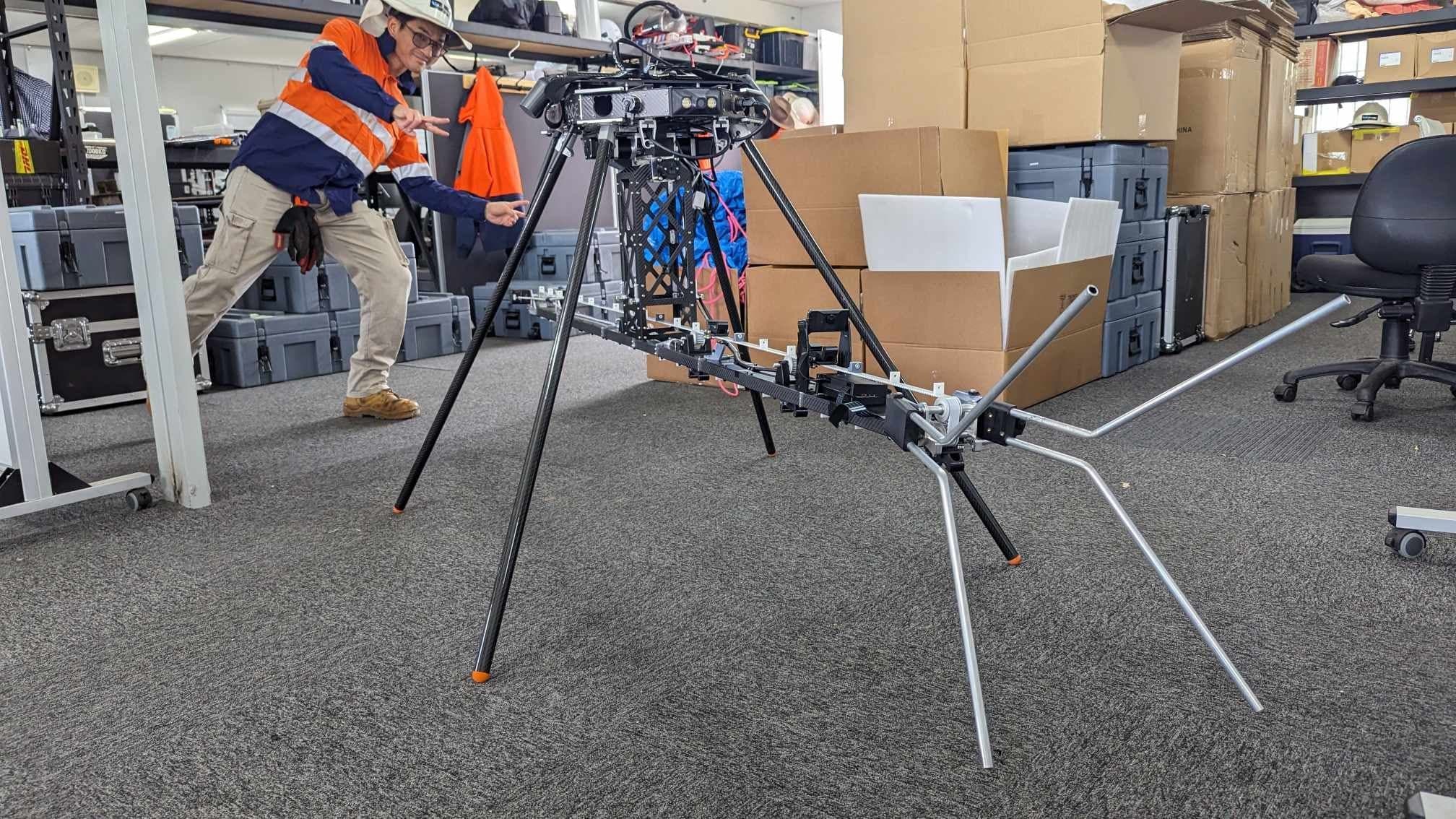 Rotamarka payload integrated beneath the drone during an indoor system review